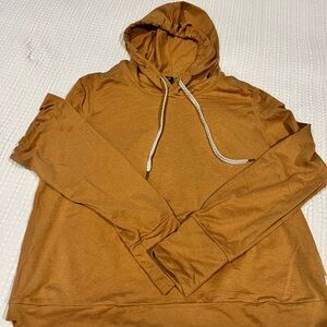 Popular Vuori hoodie in mustard.